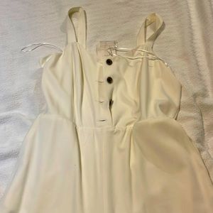 Cream jumpsuit with marbled buttons